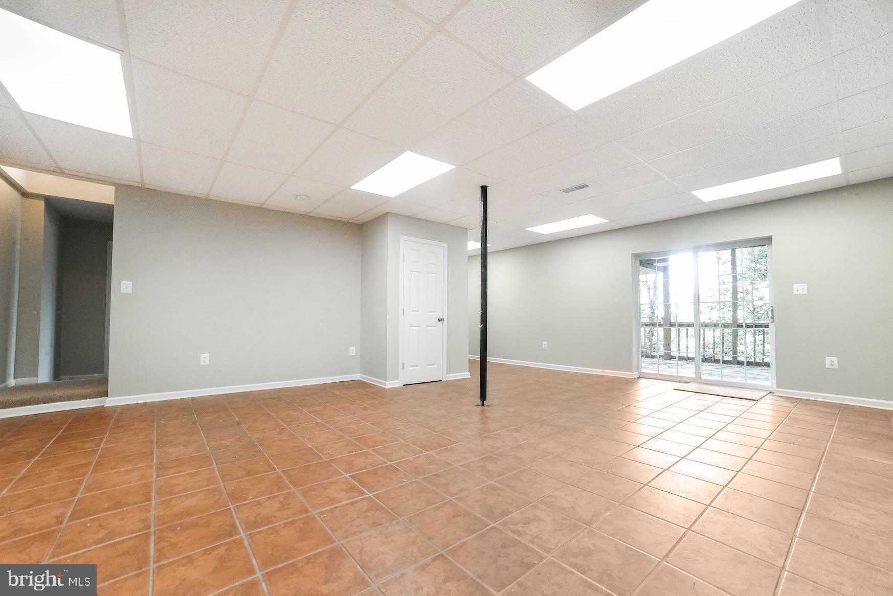 12756 Bullet Bend Road Lusby, MD 20657 - Photo 51 of 56 a view of an empty room with a window