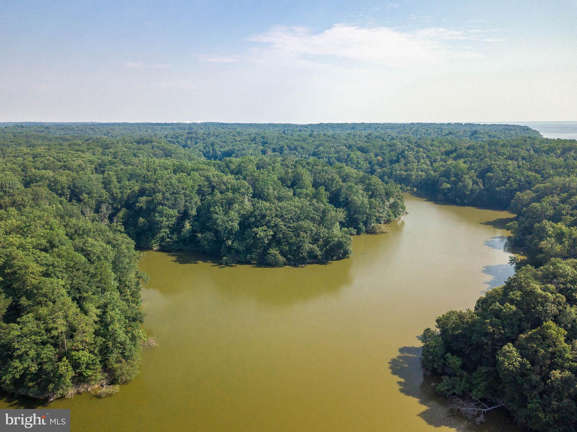 12756 Bullet Bend Road Lusby, MD 20657 - Photo 7 of 56 an aerial view of ocean with green space