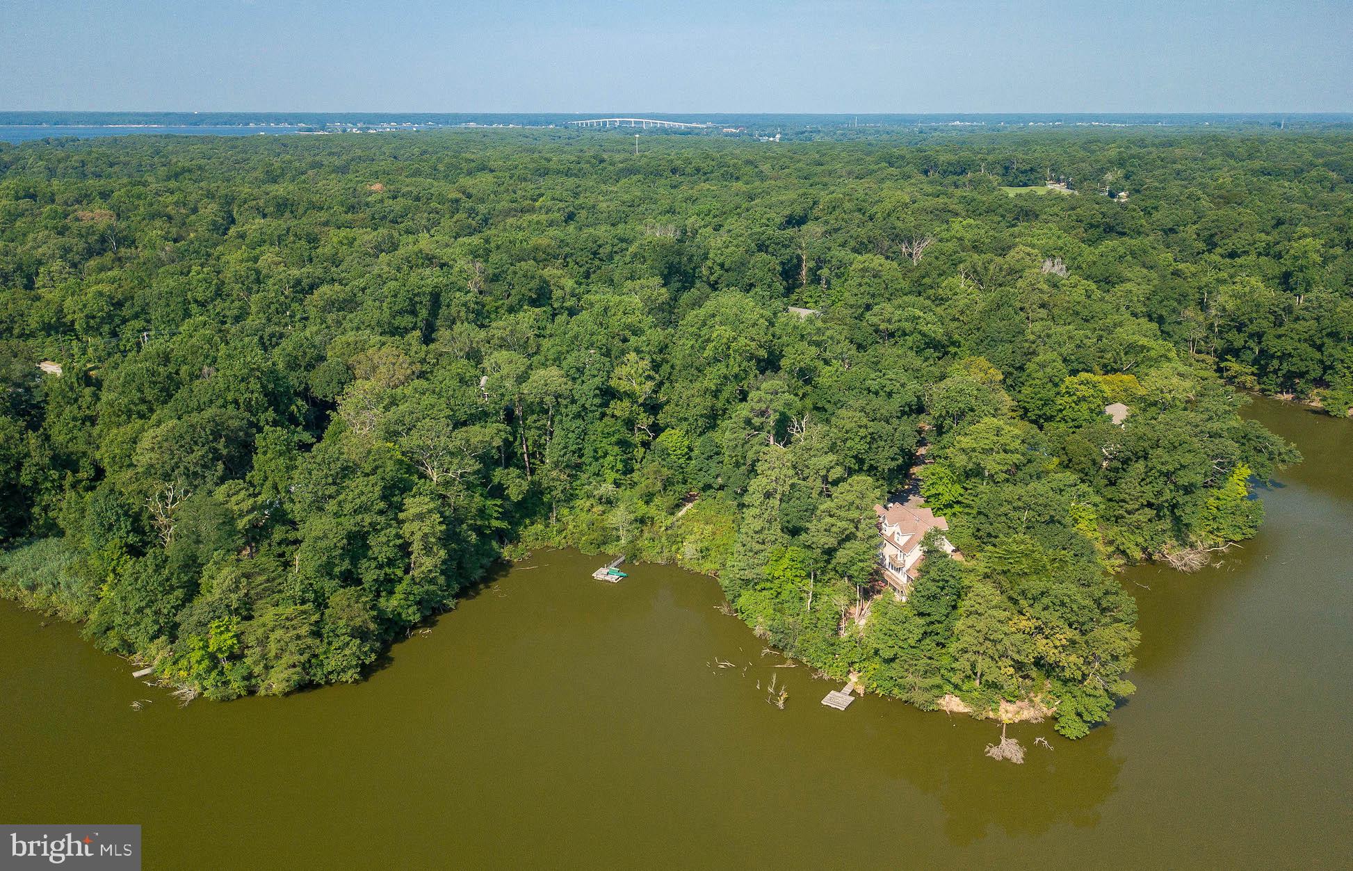 12756 Bullet Bend Road Lusby, MD 20657 - Photo 9 of 56 a view of a lake with a yard