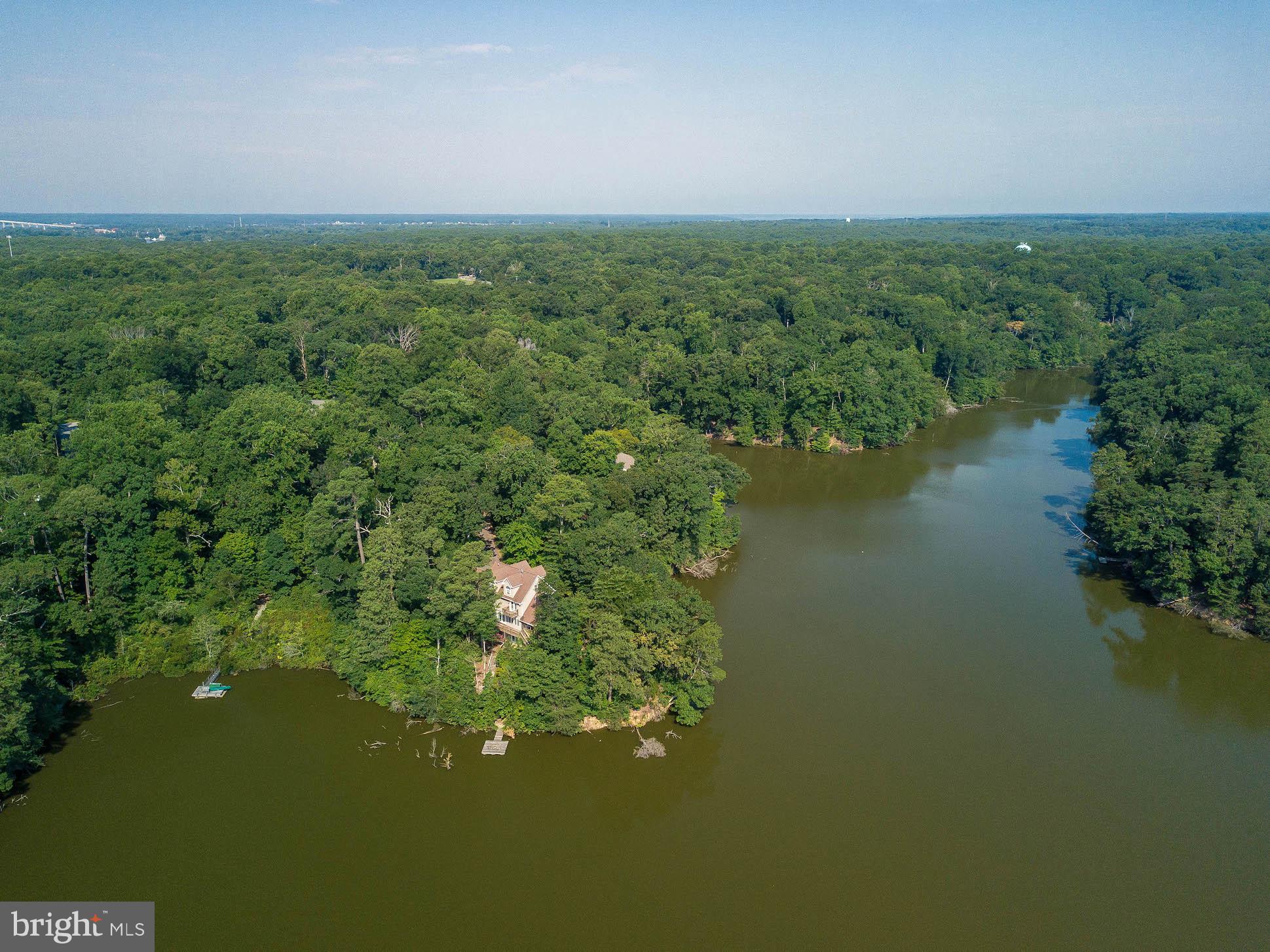 12756 Bullet Bend Road Lusby, MD 20657 - Photo 10 of 56 a view of a lake with a city