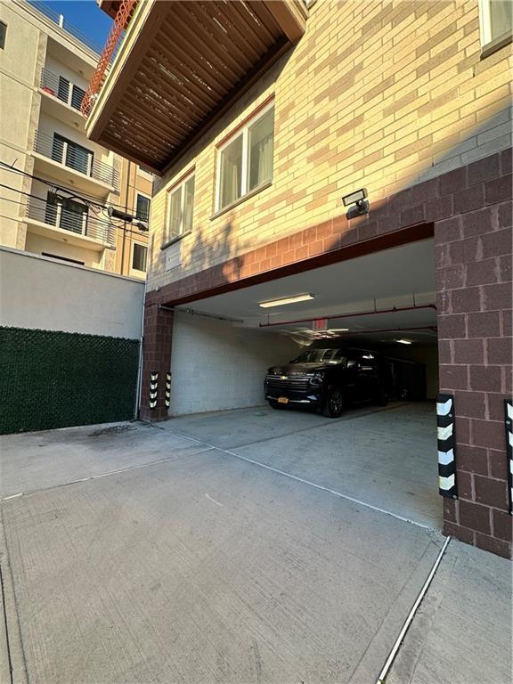 3016 Brighton 5th Street, Unit 1A Brooklyn, NY 11235 - Photo 13 of 15 a car parked in front of a building
