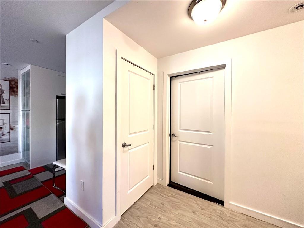 3016 Brighton 5th Street, Unit 1A Brooklyn, NY 11235 - Photo 3 of 15 a view of a room with wooden floor