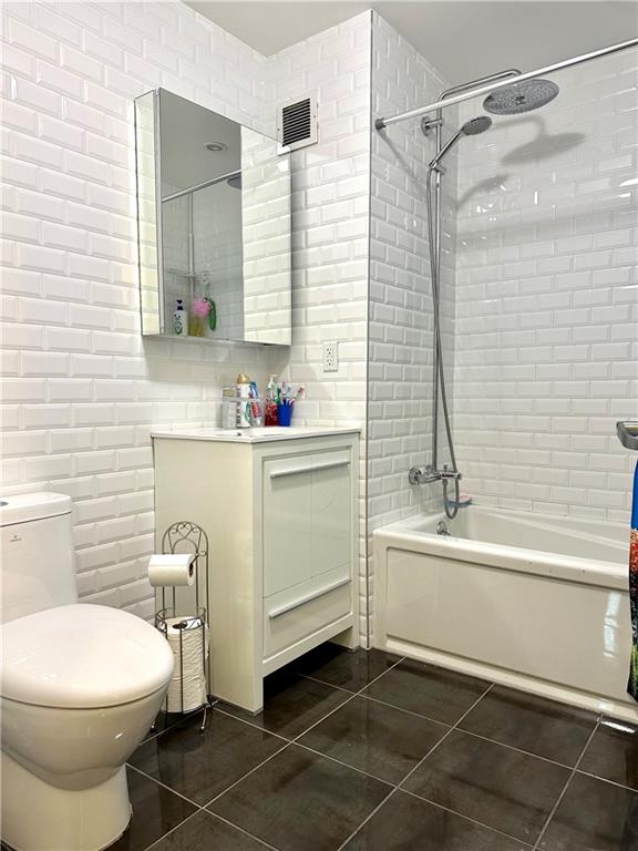 3016 Brighton 5th Street, Unit 1A Brooklyn, NY 11235 - Photo 10 of 15 a bathroom with a sink toilet and shower