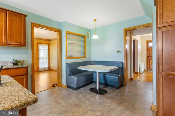 a view of a livingroom with furniture and cabinet