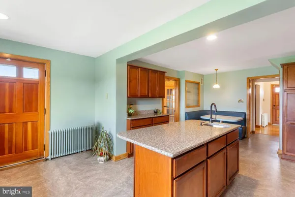a kitchen with a stove a sink and a refrigerator