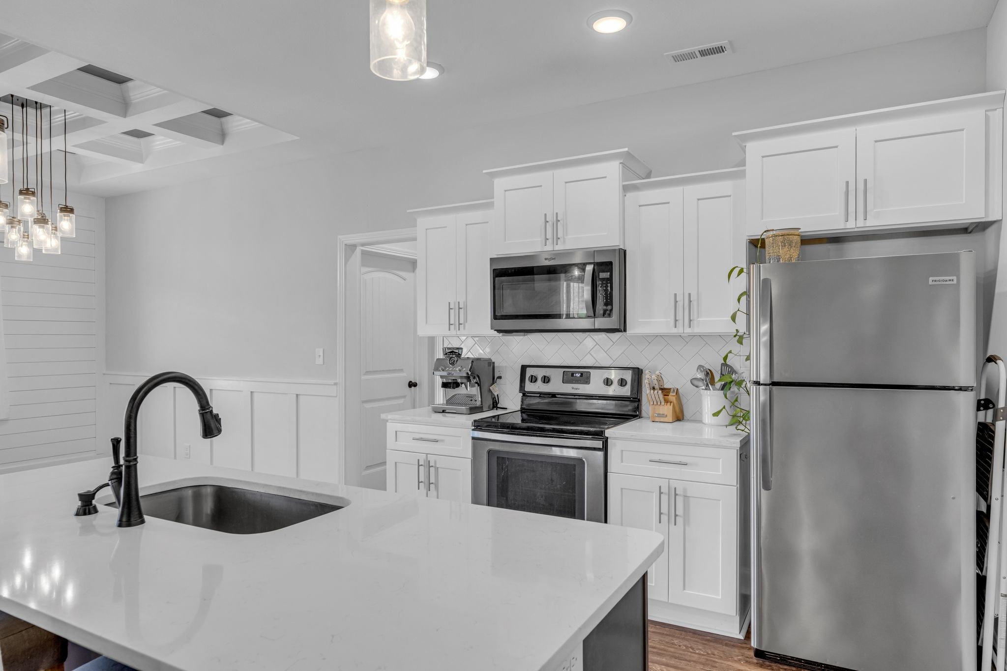 1277 Lecomte Road Dickson, TN 37055 - Photo 9 of 30 a kitchen with stainless steel appliances a refrigerator sink and white cabinets
