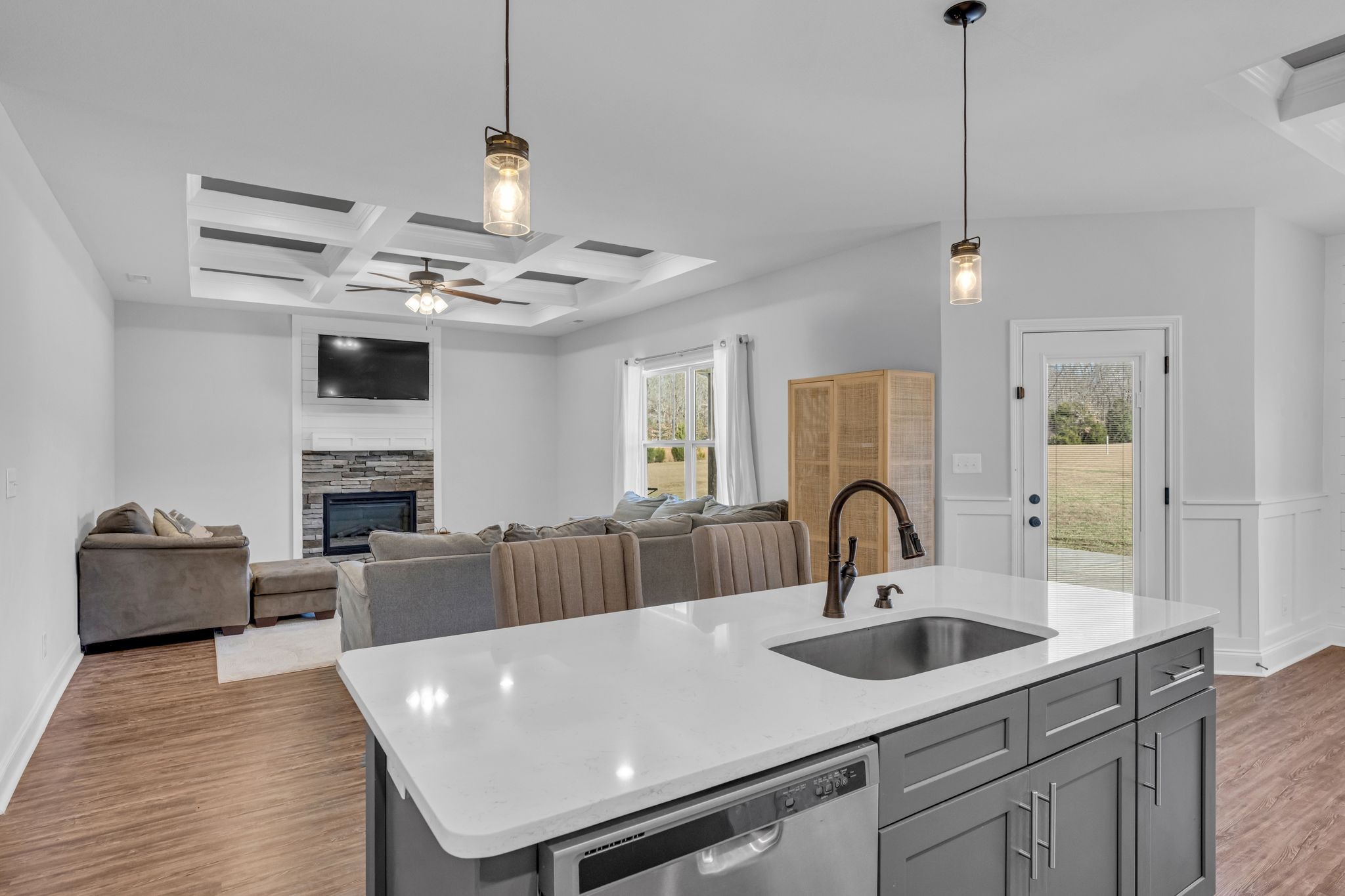 1277 Lecomte Road Dickson, TN 37055 - Photo 10 of 30 a living room with furniture a fireplace and kitchen view