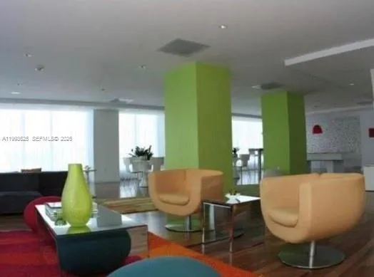 a room with pool table and window