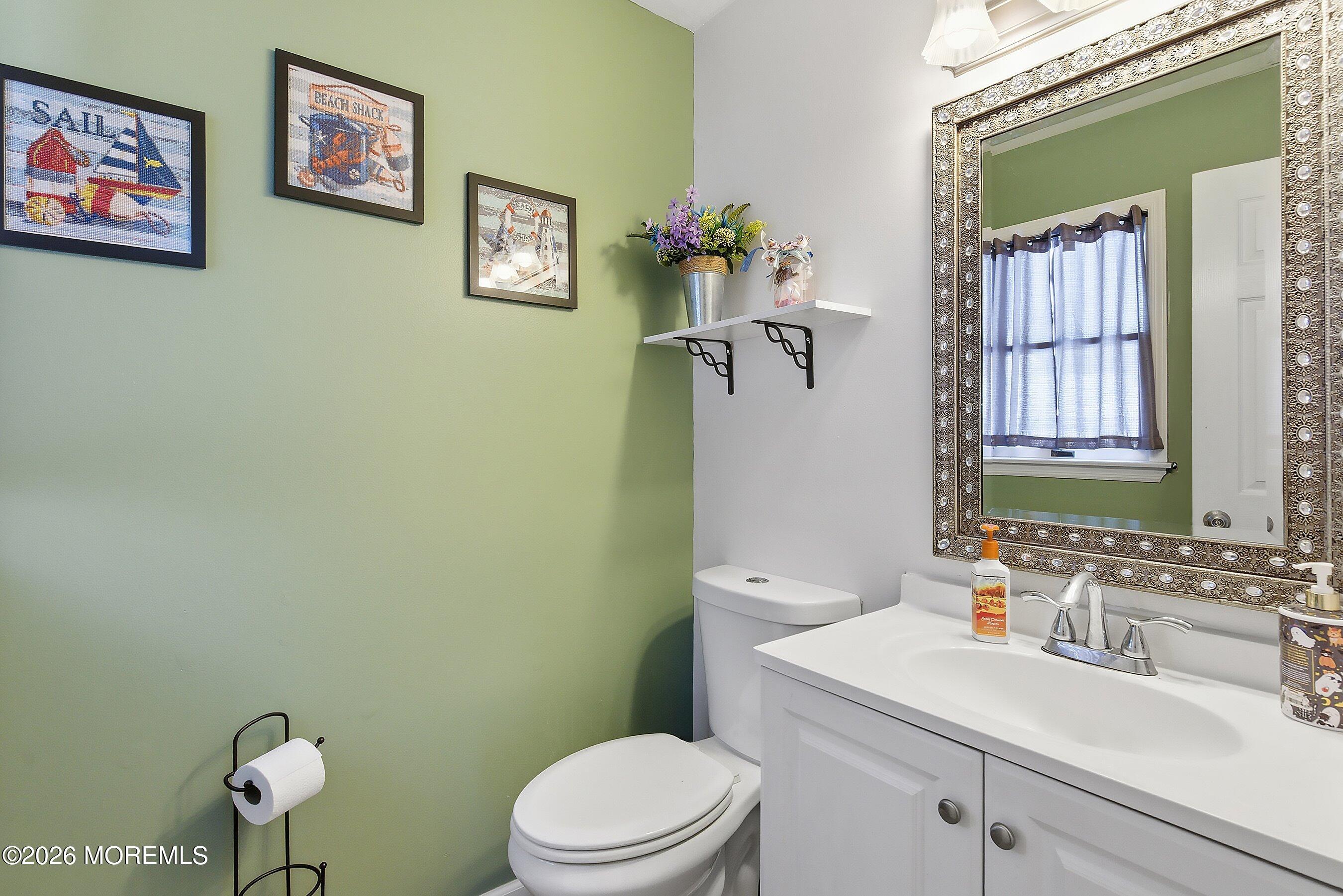 7 Letts Landing Road Waretown, NJ 08758 - Photo 12 of 18 a bathroom with a sink mirror vanity and toilet