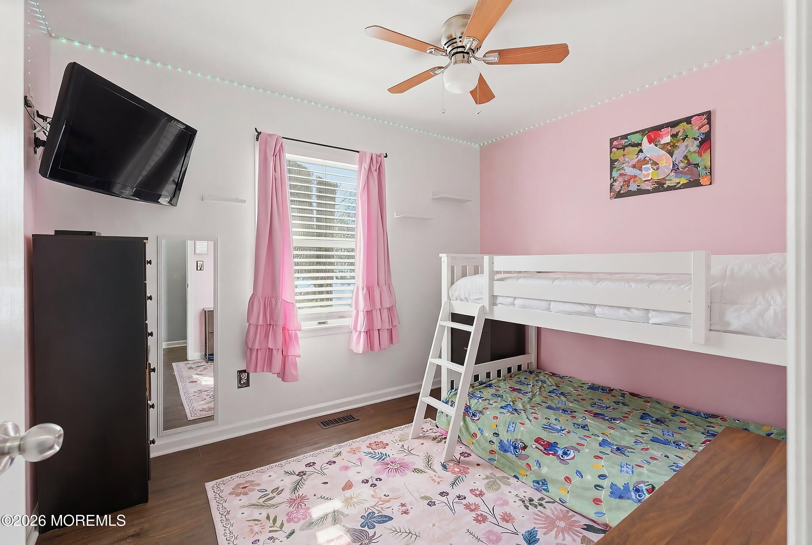 7 Letts Landing Road Waretown, NJ 08758 - Photo 14 of 18 a bedroom with a bed and a flat screen tv