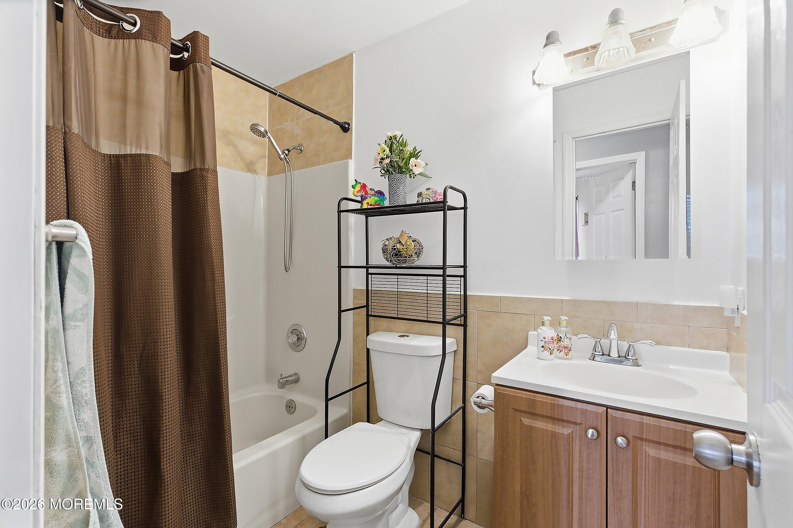 7 Letts Landing Road Waretown, NJ 08758 - Photo 16 of 18 a white toilet sitting next to a bathroom sink