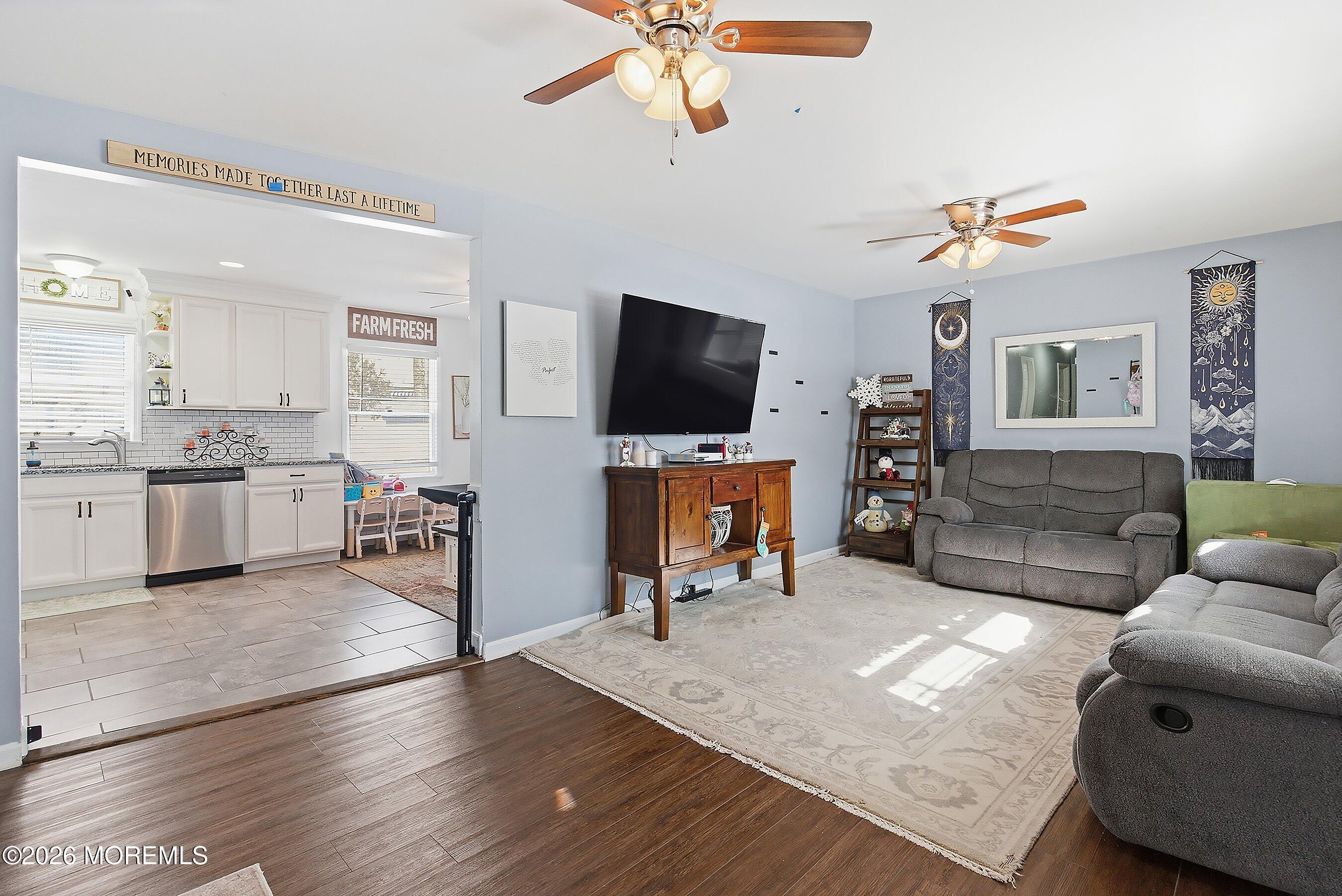 7 Letts Landing Road Waretown, NJ 08758 - Photo 4 of 18 a living room with furniture and a flat screen tv