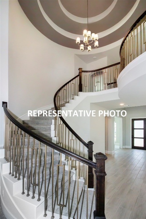 210 Rio Ranchero Road Georgetown, TX 78628 - Photo 1 of 1 a view of staircase with railing and wooden floor