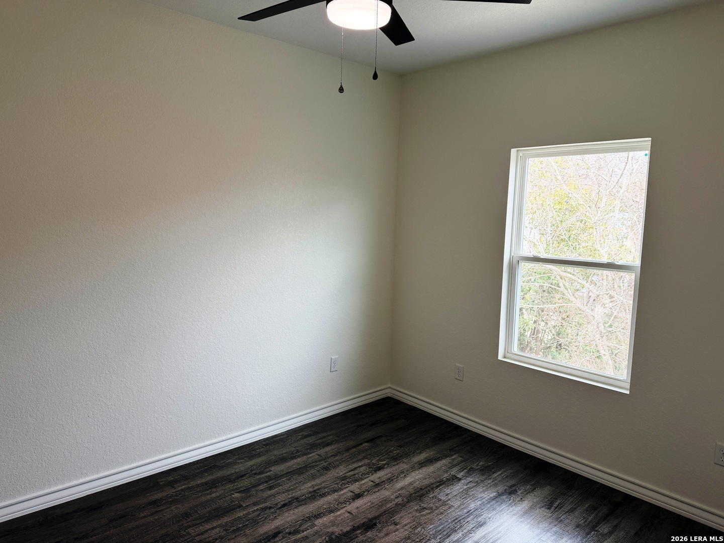 600 A 10th Bandera, TX 78003 - Photo 9 of 13 an empty room with a window