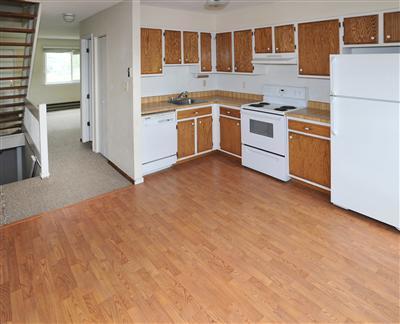 85 Chambers Avenue, Unit 5 Eagle, CO 81631 - Photo 4 of 14 a kitchen with a stove top oven and white cabinets