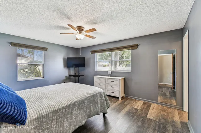 a workspace with furniture hardwood and a window