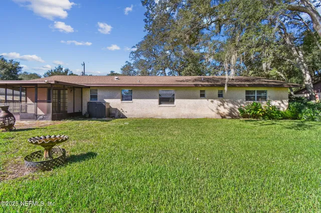 an aerial view of a residential houses with outdoor space