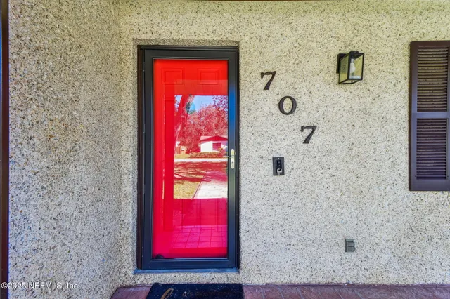 a living room with a couch and a window