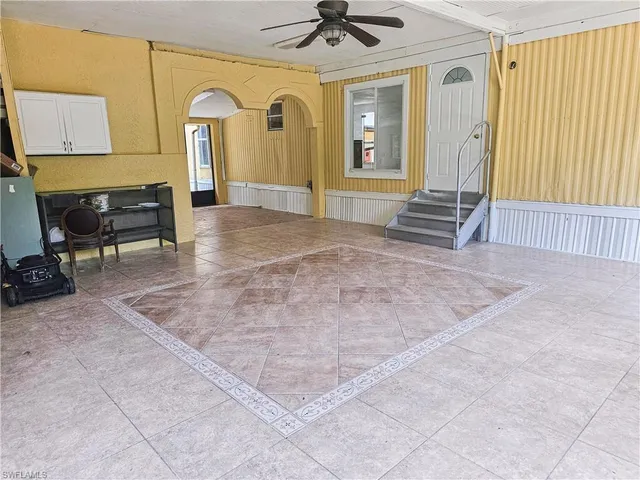 a view of livingroom with couch and window