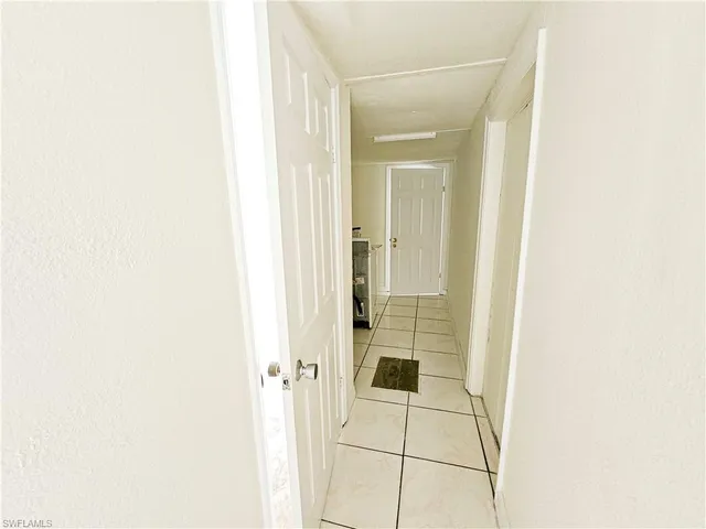 a bathroom with a toilet sink and a mirror