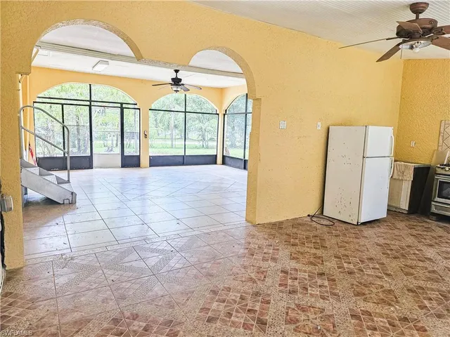 a view of a kitchen with a sink and a window