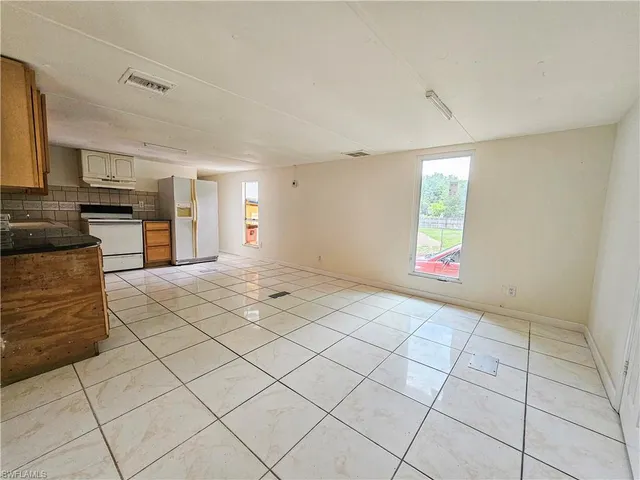 a view of livingroom with couch and window