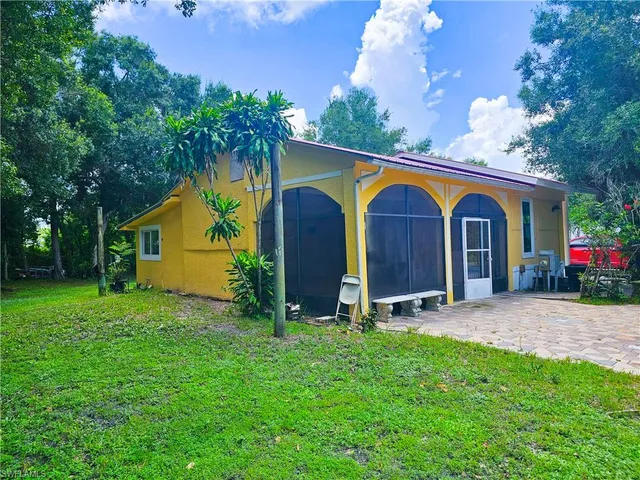 a view of a back yard of the house