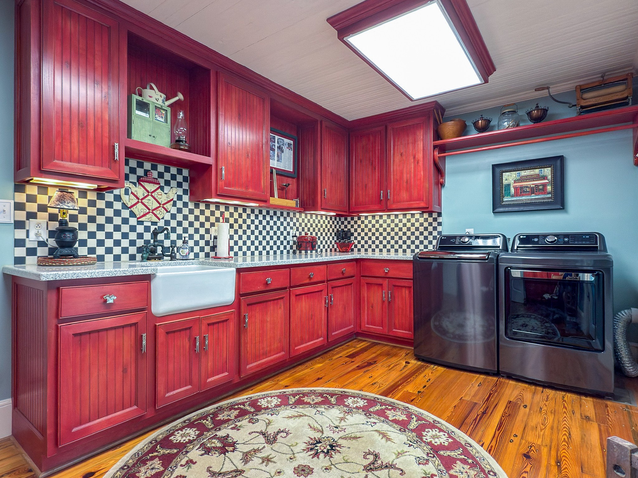 4929 Snow Creek Road Santa Fe, TN 38482 - Photo 12 of 59 a kitchen with red cabinets and window