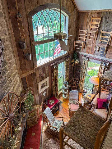 a bedroom with a bed couch and window