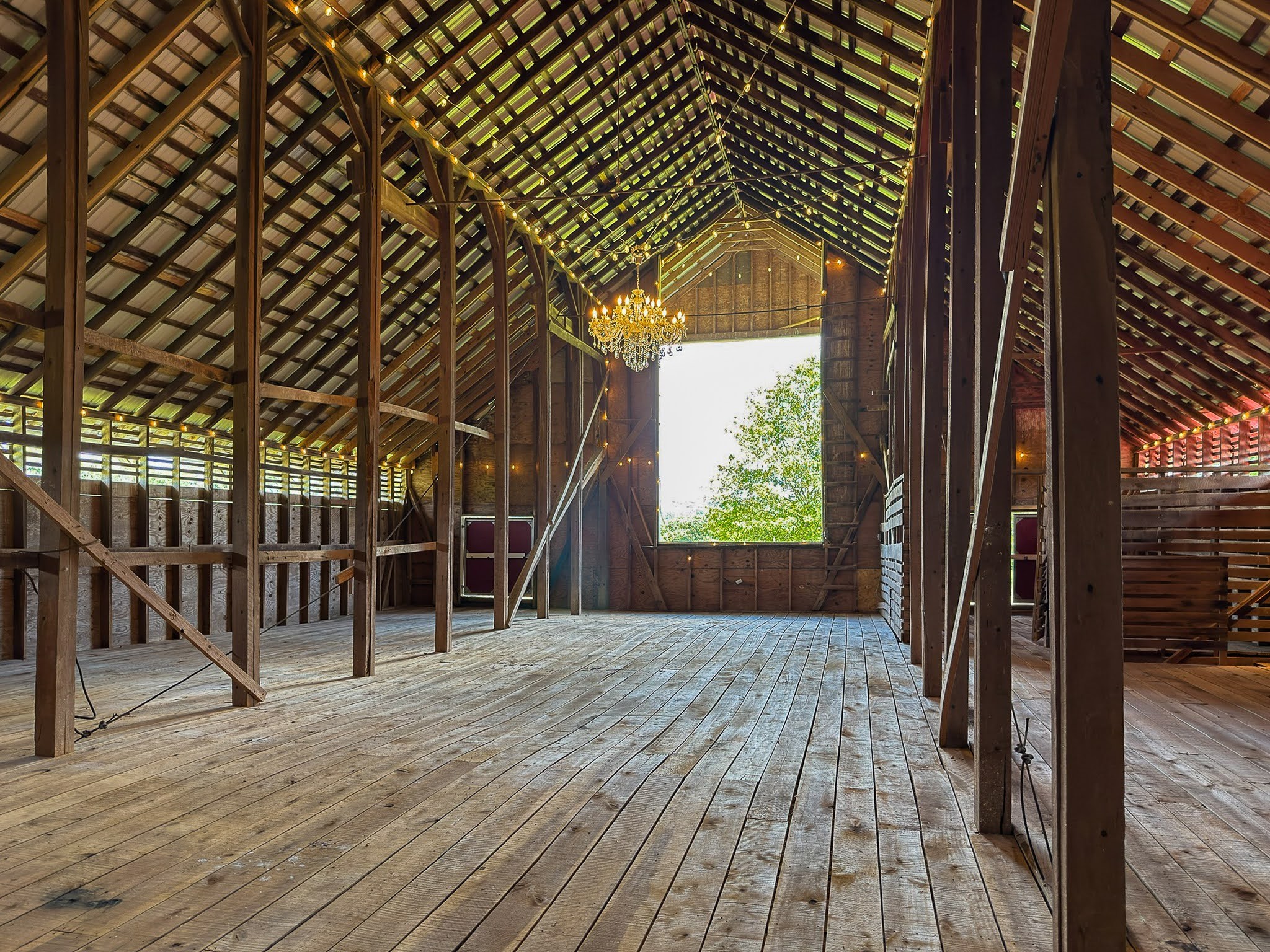 4929 Snow Creek Road Santa Fe, TN 38482 - Photo 37 of 59 an empty room with wooden floor and windows