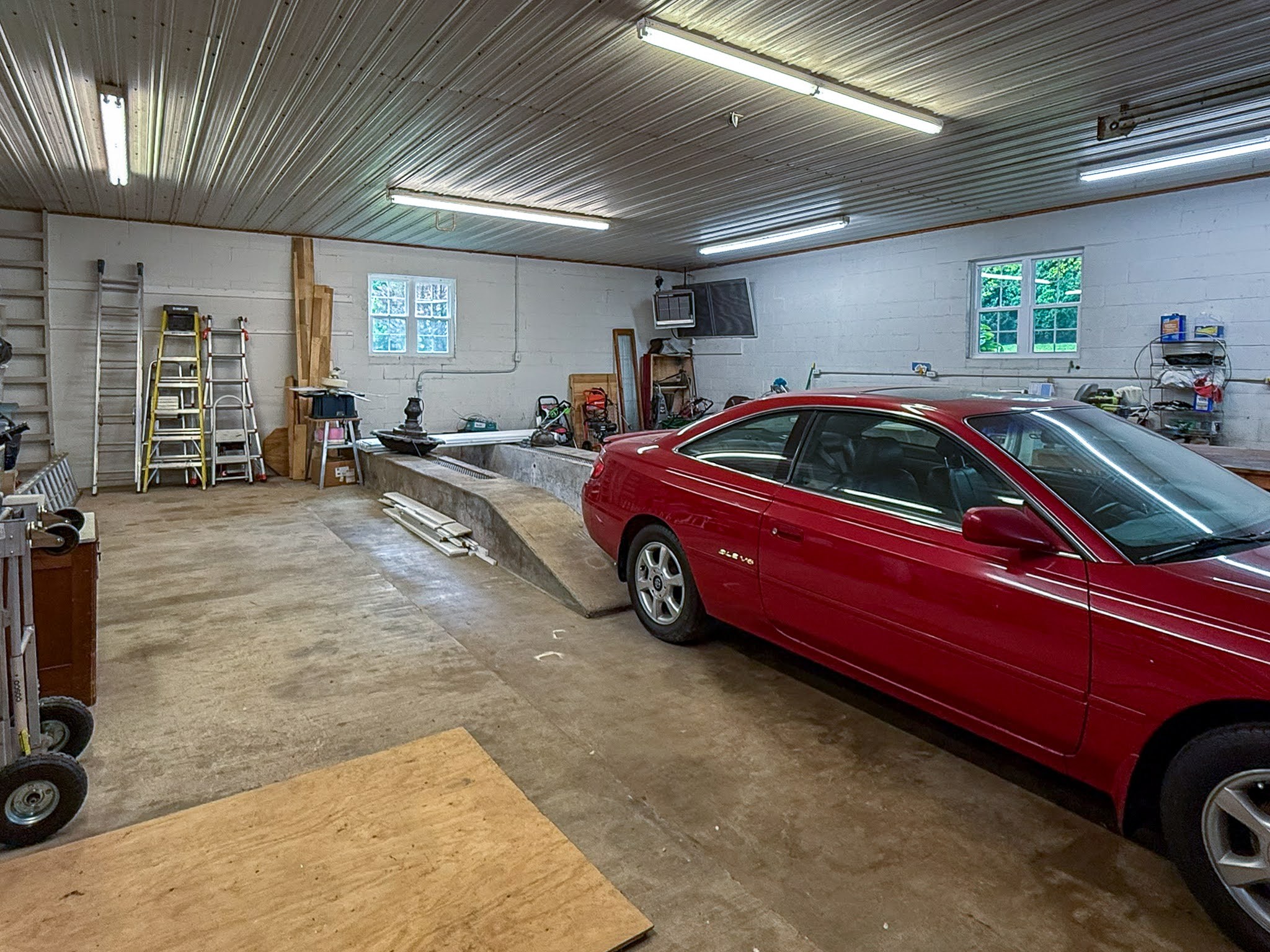 4929 Snow Creek Road Santa Fe, TN 38482 - Photo 39 of 59 a car is parked in a garage