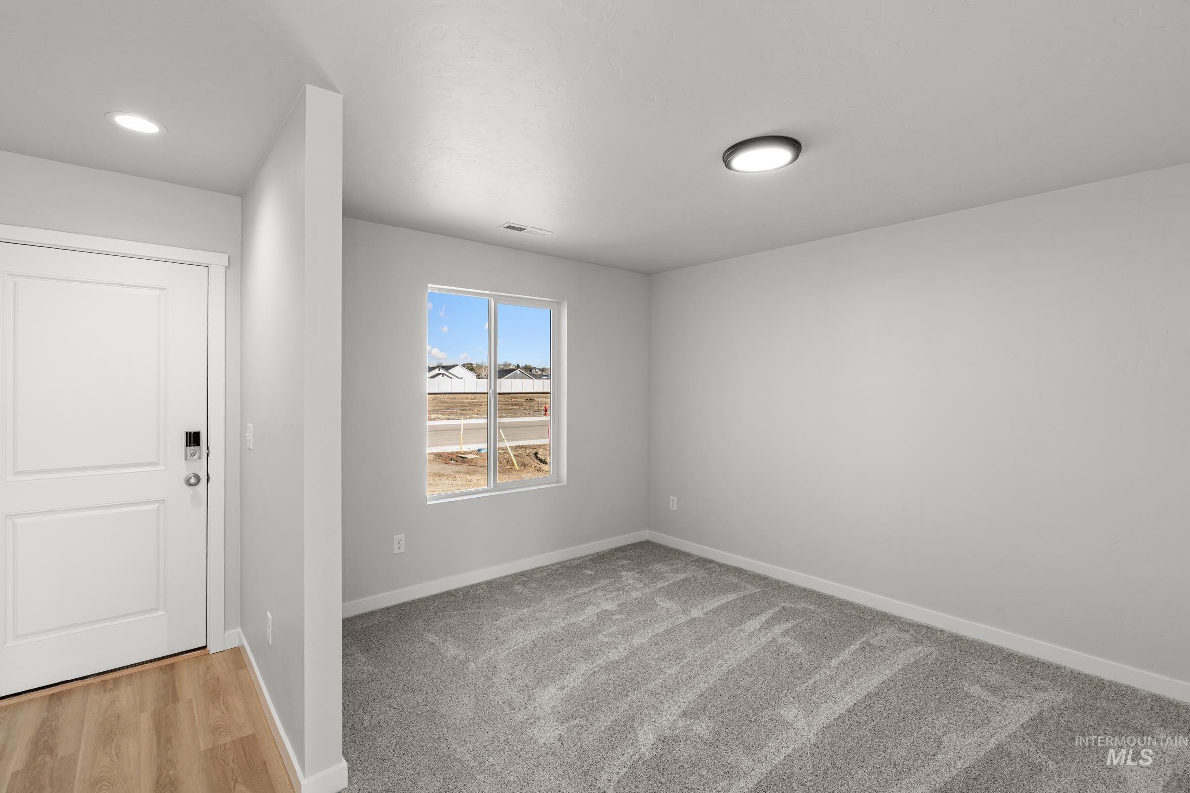 1687 Dyer Street Middleton, ID 83644 - Photo 12 of 28 Foyer with baseboards and light carpet