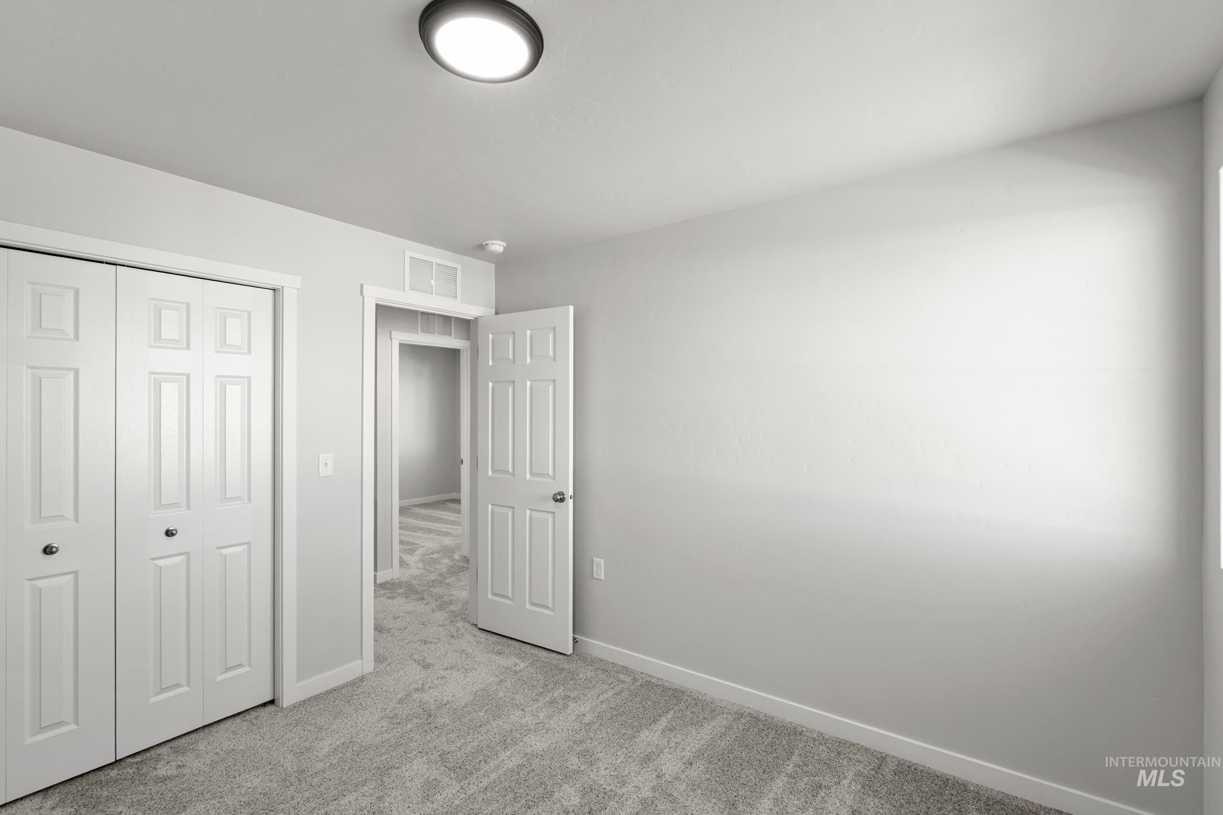 1687 Dyer Street Middleton, ID 83644 - Photo 19 of 28 Unfurnished bedroom with carpet and a closet
