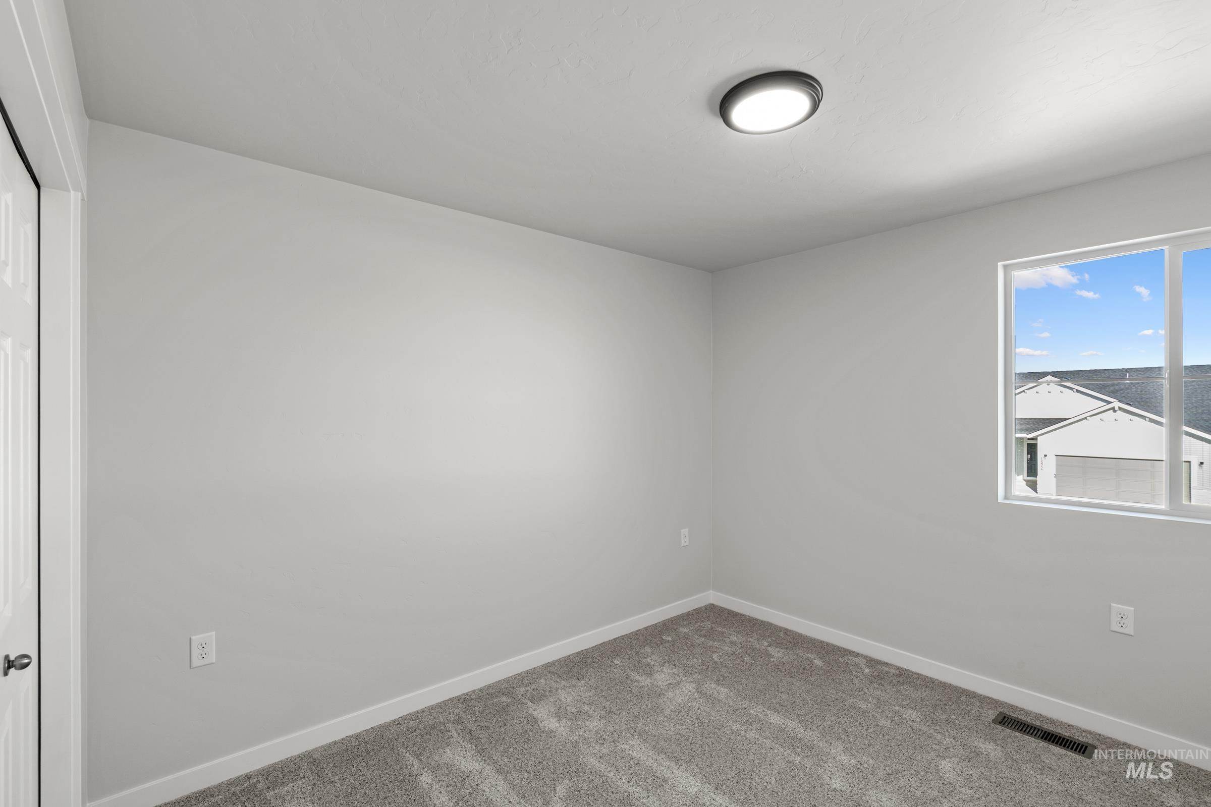 1687 Dyer Street Middleton, ID 83644 - Photo 20 of 28 Unfurnished room with baseboards and carpet floors