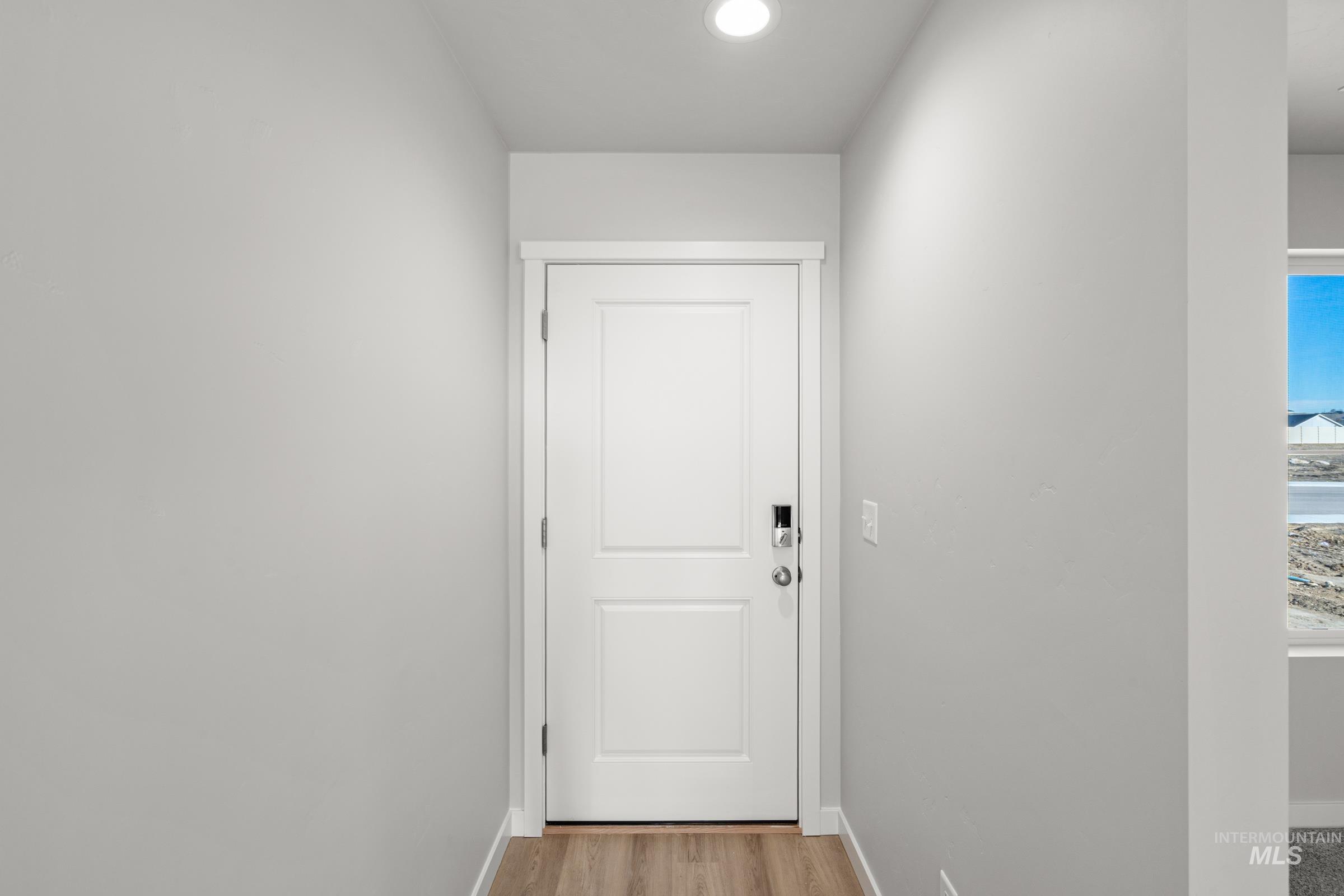 1687 Dyer Street Middleton, ID 83644 - Photo 2 of 28 Doorway to outside featuring baseboards and wood finished floors