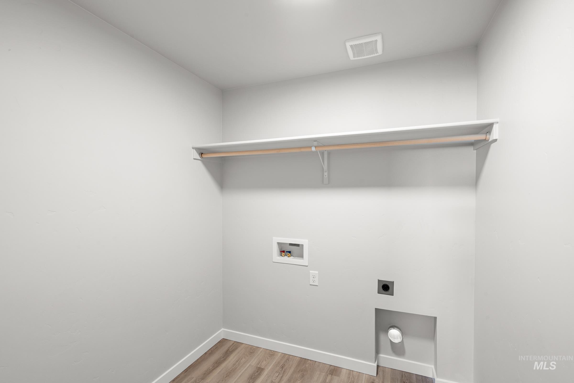 1687 Dyer Street Middleton, ID 83644 - Photo 22 of 28 Laundry area with light wood finished floors, electric dryer hookup, and hookup for a washing machine