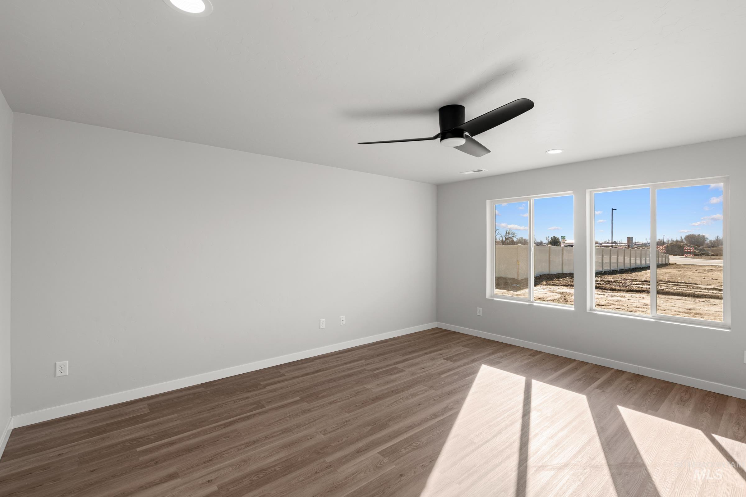 1687 Dyer Street Middleton, ID 83644 - Photo 9 of 28 Spare room with light wood-type flooring, recessed lighting, and ceiling fan