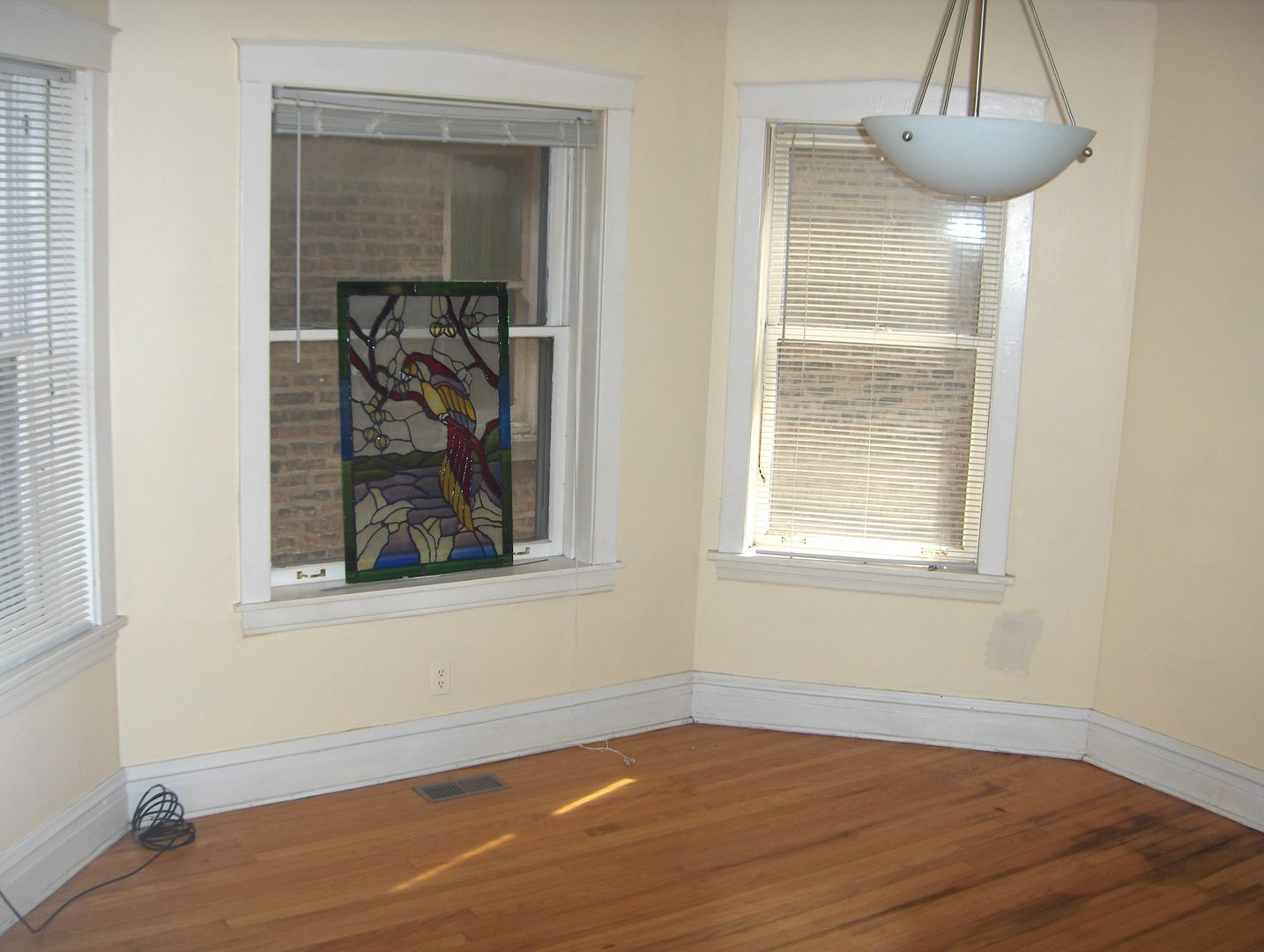 4039 North Long Avenue, Unit 1 Chicago, IL 60641 - Photo 11 of 20 a view of a room with wooden floor and a window