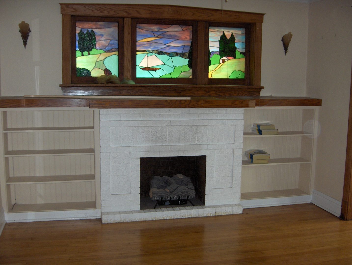4039 North Long Avenue, Unit 1 Chicago, IL 60641 - Photo 12 of 20 a living room with a fireplace and a window