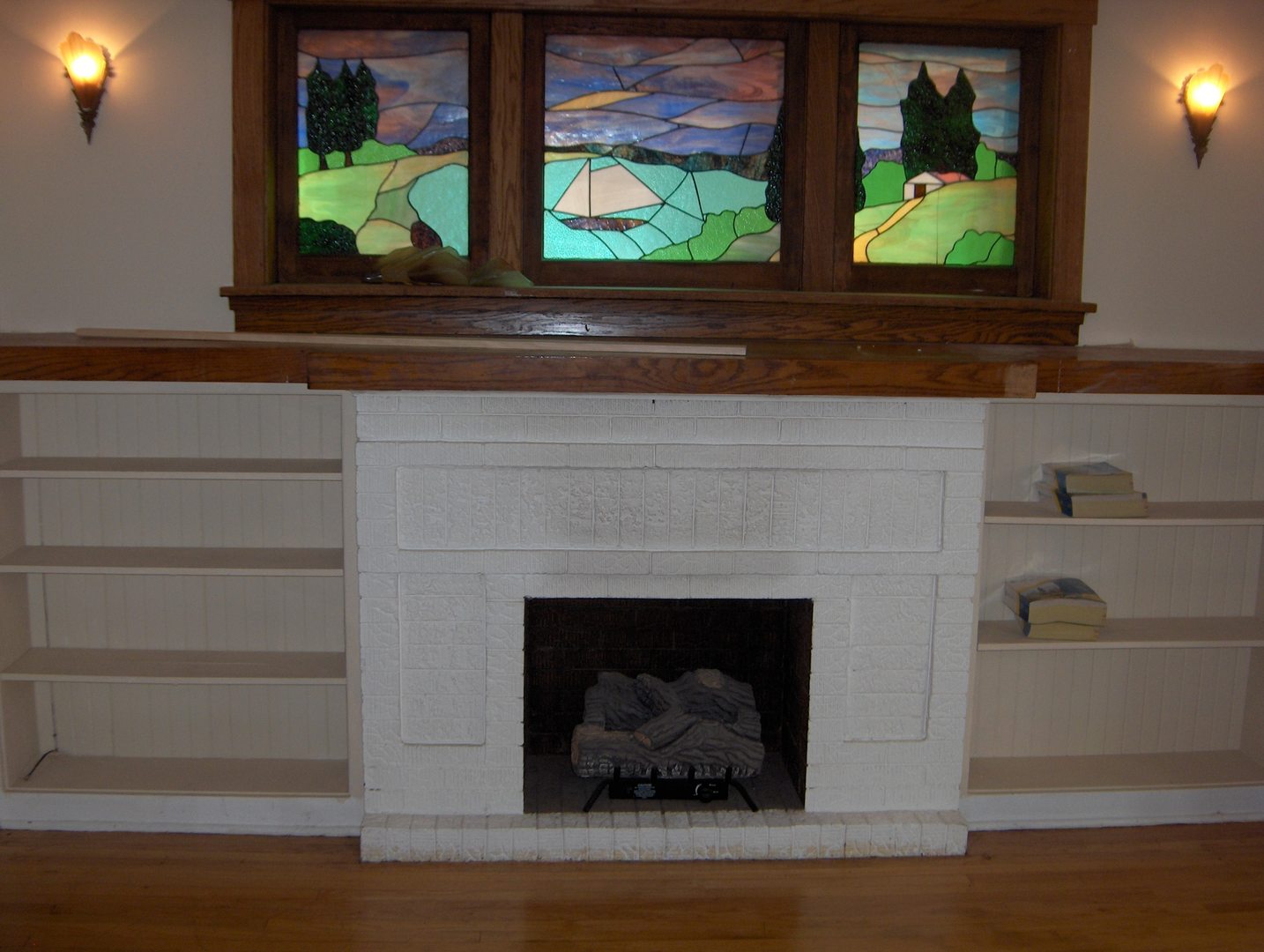 4039 North Long Avenue, Unit 1 Chicago, IL 60641 - Photo 13 of 20 a living room with a fireplace and a painting on the wall