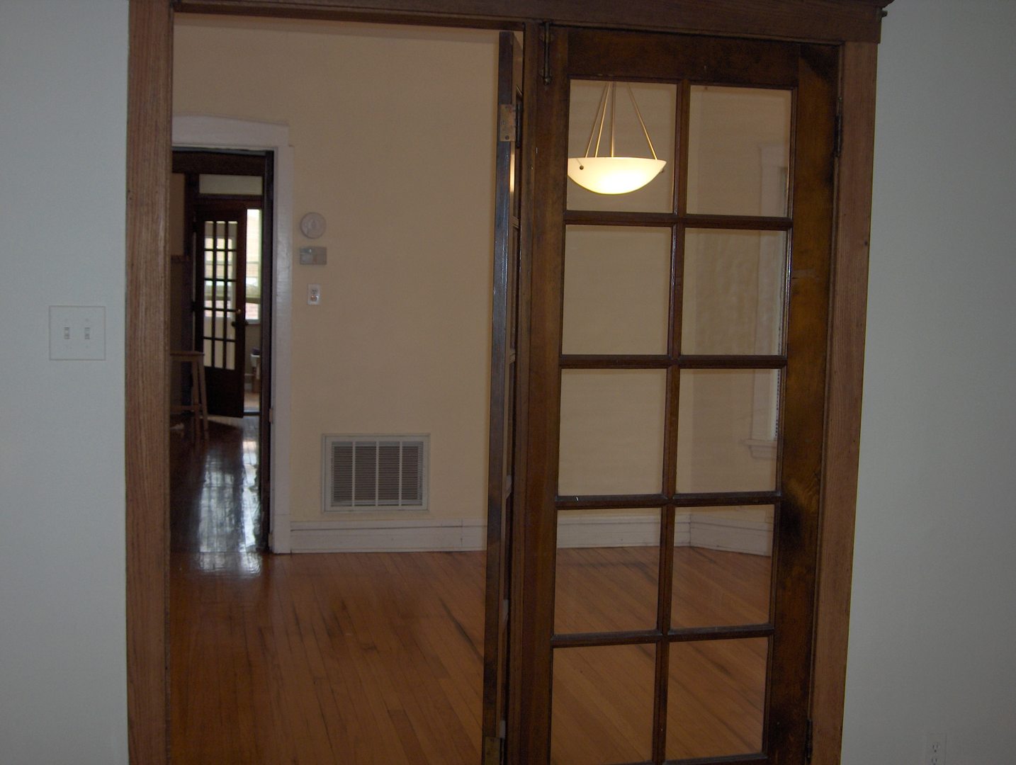 4039 North Long Avenue, Unit 1 Chicago, IL 60641 - Photo 16 of 20 a view of staircase with a door and wooden floor