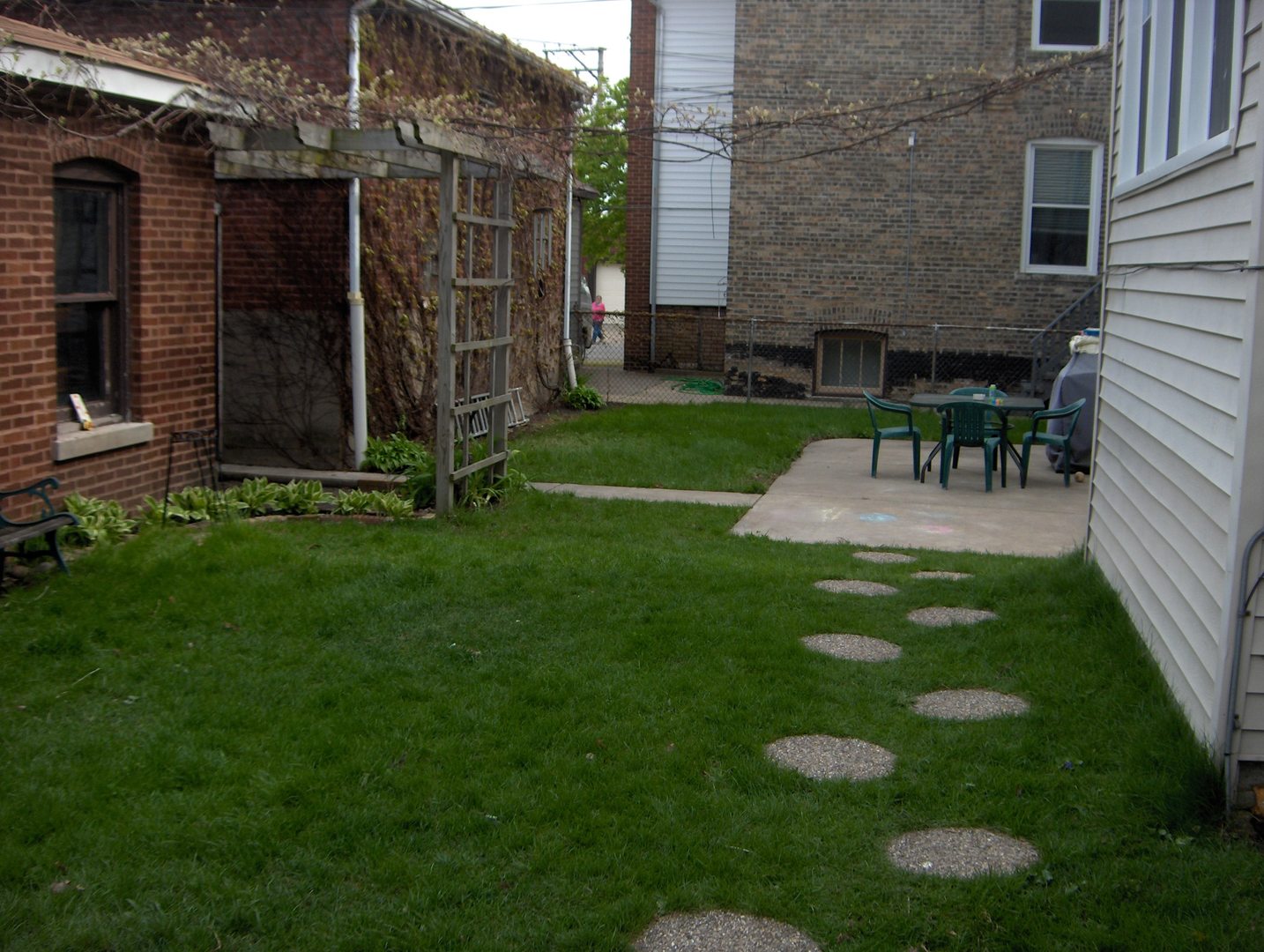 4039 North Long Avenue, Unit 1 Chicago, IL 60641 - Photo 19 of 20 a view of a chair and table in backyard of the house