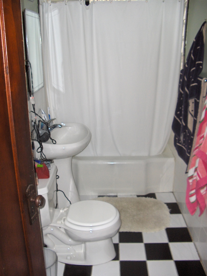 4039 North Long Avenue, Unit 1 Chicago, IL 60641 - Photo 3 of 20 a bathroom with a sink and a toilet