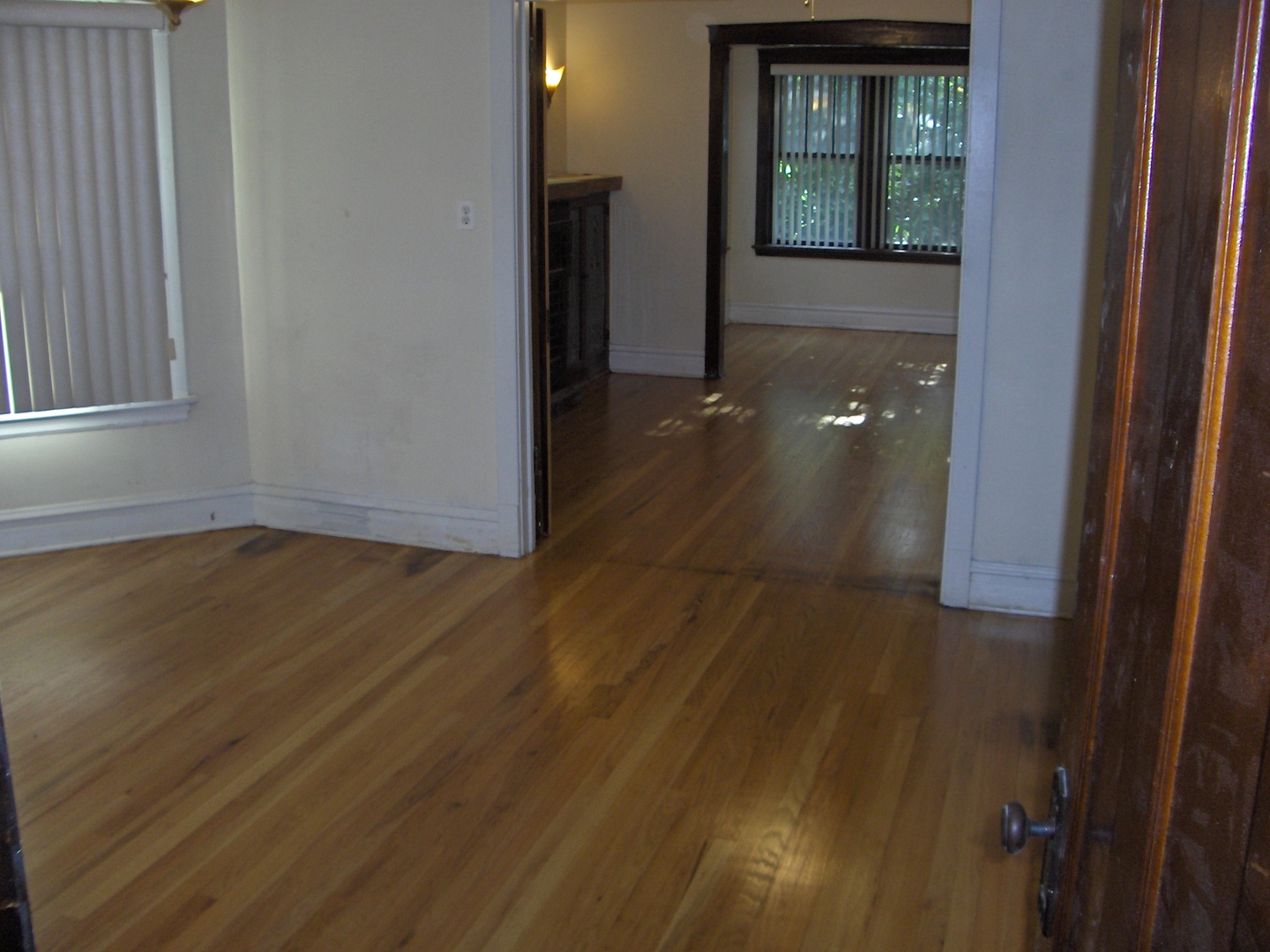 4039 North Long Avenue, Unit 1 Chicago, IL 60641 - Photo 5 of 20 an empty room with wooden floor and closet