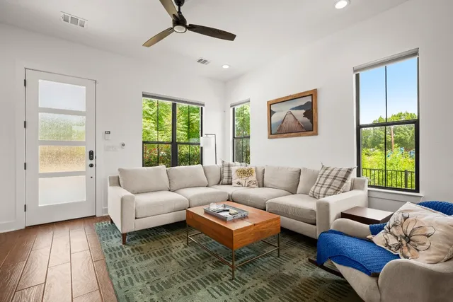 a living room with furniture and a window