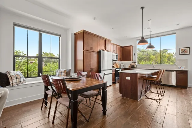 a view of a dining room with furniture window and outside view