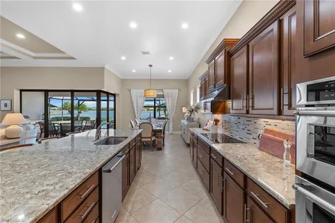 a large kitchen with stainless steel appliances granite countertop plenty counter space