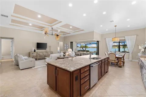 a view of living room filled with furniture and a flat screen tv