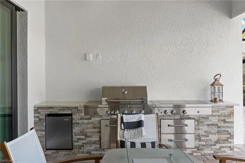 a kitchen with cabinets and appliances
