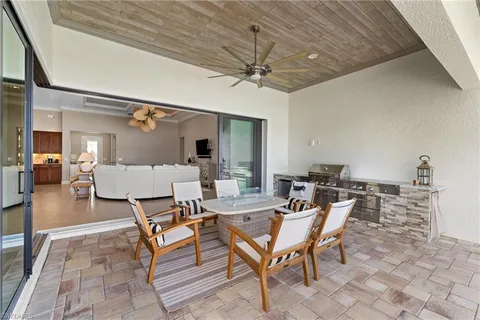 a outdoor space with the couches and a table and chairs